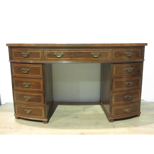 580 - A 19th Century mahogany bowfront Desk fitted eleven drawers 4 ft 9 in W x 2 ft 8 in H x 1 ft 10 in D... 