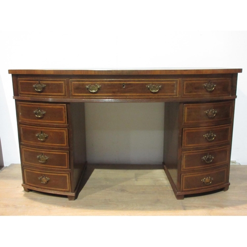 580 - A 19th Century mahogany bowfront Desk fitted eleven drawers 4 ft 9 in W x 2 ft 8 in H x 1 ft 10 in D... 