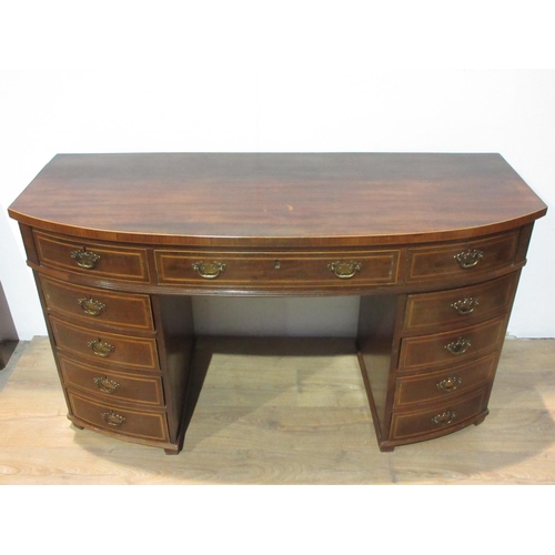 580 - A 19th Century mahogany bowfront Desk fitted eleven drawers 4 ft 9 in W x 2 ft 8 in H x 1 ft 10 in D... 