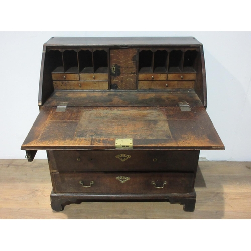 582 - An antique oak Bureau fitted four long drawers, 3 ft 2 in W A/F.