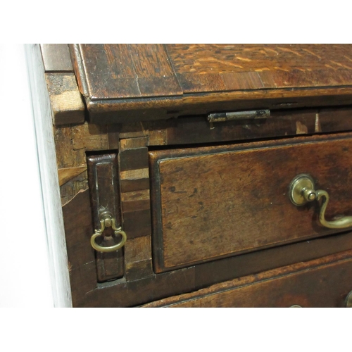 582 - An antique oak Bureau fitted four long drawers, 3 ft 2 in W A/F.