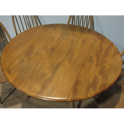 583 - A pale elm Ercol Dining Table and four Chairs, 4 ft open x 3 ft 7 in.