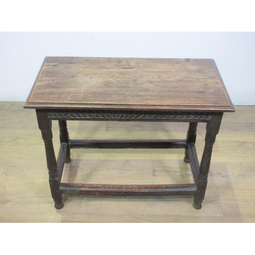 601 - A small 18th Century oak Centre Table with carved frieze and turned supports, possibly with later to... 