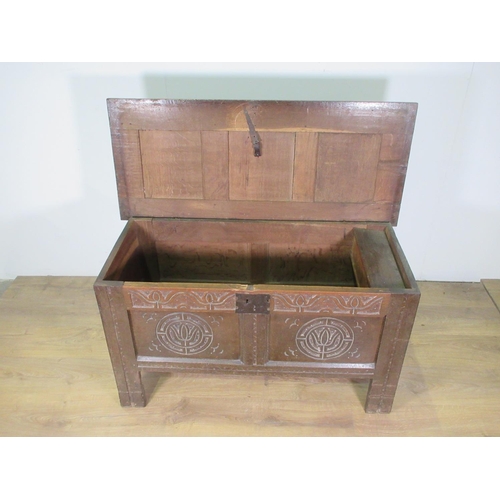 602 - A small 17th Century and later oak Coffer with panelled top and carved panelled front, 3 ft 7 in W.