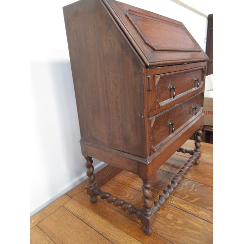 613 - A small oak Bureau, 2ft 6in W and an oak Drawleaf Dining Table on spiral supports