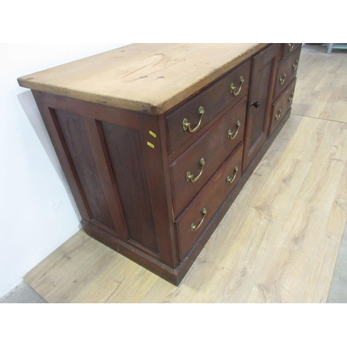 631 - A Victorian pitch pine Dresser Base fitted two banks of three drawers flanking a panel cupboard door... 