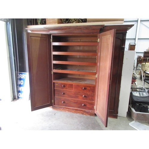 652 - A good quality Victorian flame mahogany Breakfront Wardrobe fitted four arched panel doors, the cent... 