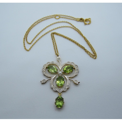 102 - A Peridot Diamond and Pearl Pendant, the openwork shamrock shaped plaque claw-set four oval-cut peri... 