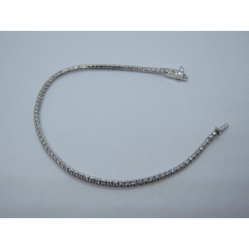 104 - A Diamond Tennis Bracelet, having flexible links each set brilliant-cut stone on hidden clasp in 18c... 