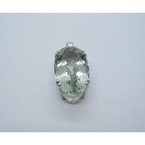 110 - A Zoizite Pendant, claw-set, large faceted oval stone in 18ct white gold.