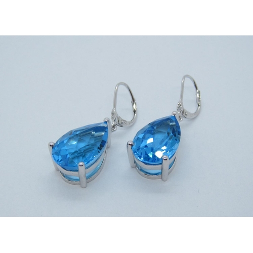 111 - A pair of Blue Topaz Ear Pendants, each claw-set, single pear-cut stone, total topaz weight 22.69cts... 