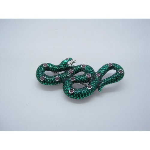 113 - A Green Enamel on white metal Snake Pendant/Brooch set pink stones.