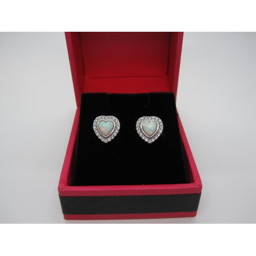 114 - A pair of synthetic Opal and CZ Earrings, each set heart-shaped synthetic opal cabochon within frame... 