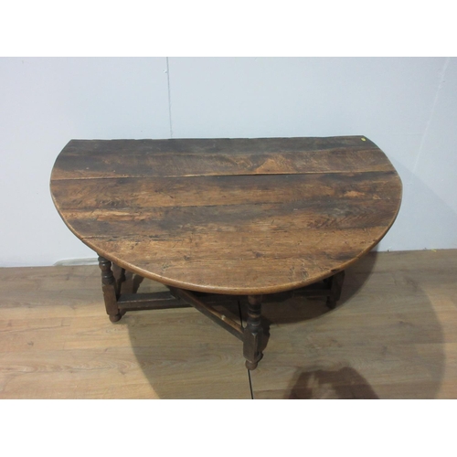 330 - An antique oak Gateleg Table with oval top, 5ft 2in open x 4ft 4in