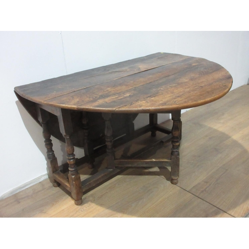 330 - An antique oak Gateleg Table with oval top, 5ft 2in open x 4ft 4in