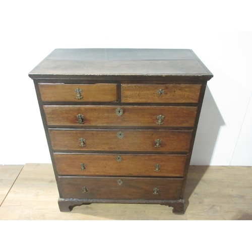 450 - A late 18th Century country oak Chest with two plank top surrounded by moulded rim fitted two short ... 