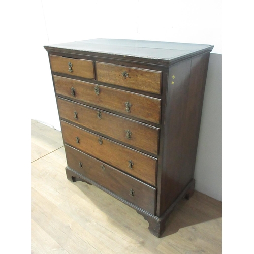 450 - A late 18th Century country oak Chest with two plank top surrounded by moulded rim fitted two short ... 