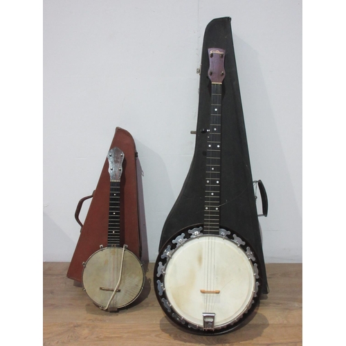 522 - A cased Banjo and a cased Ukulele