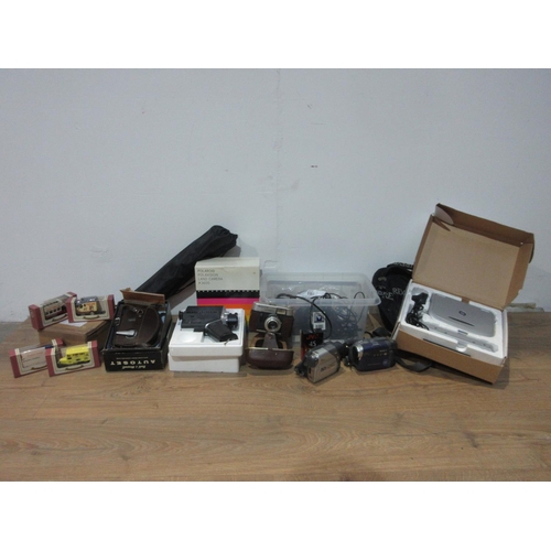 511A - A quantity of Camera Equipment including a Polaroid Land Camera, a Voigtlander Vitoret Camera, Video... 