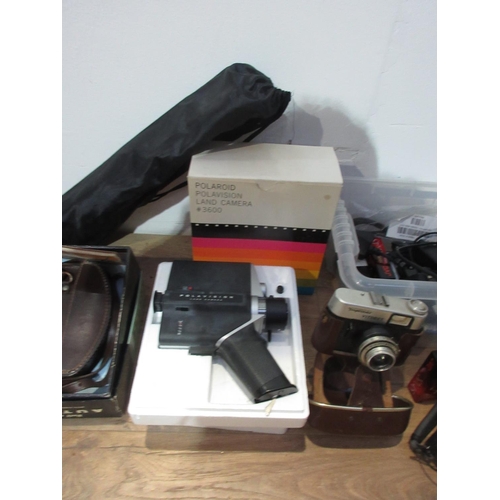 511A - A quantity of Camera Equipment including a Polaroid Land Camera, a Voigtlander Vitoret Camera, Video... 