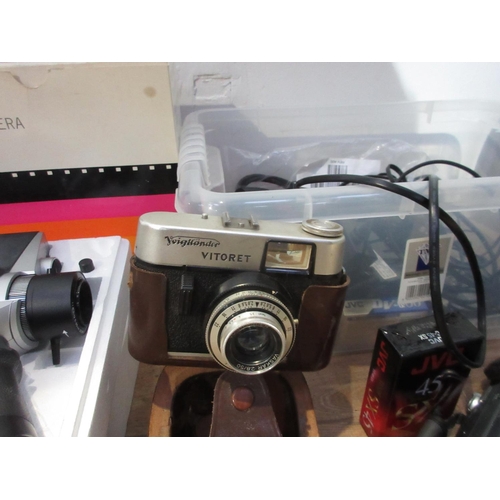 511A - A quantity of Camera Equipment including a Polaroid Land Camera, a Voigtlander Vitoret Camera, Video... 