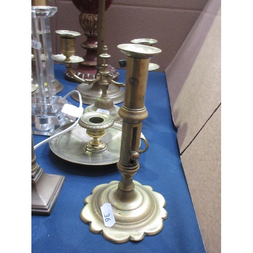 36 - A pair of tall brass Candlesticks in the 19th Century style, a short pair of brass Candlesticks on s... 