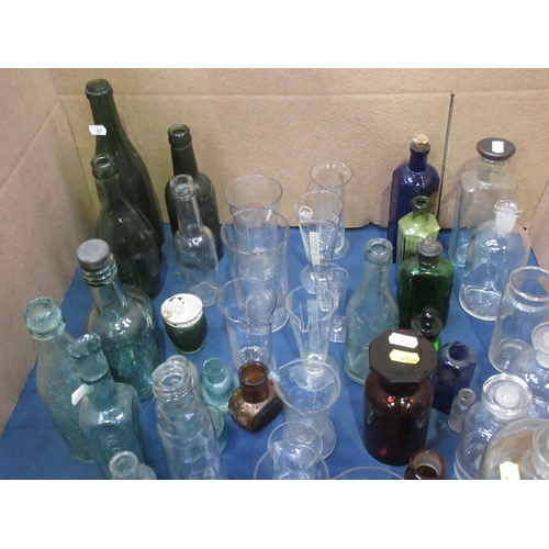 67 - A collection of Apothecary Bottles and Jars, Chemist's Measuring Vessels and other Bottles