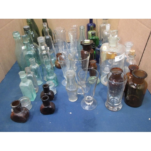 67 - A collection of Apothecary Bottles and Jars, Chemist's Measuring Vessels and other Bottles