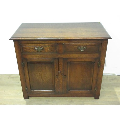 589 - A reproduction oak Dresser Base, fitted drawers and cupboards, 5 ft 6 in W x 2 ft 11 in H x 21 in D.