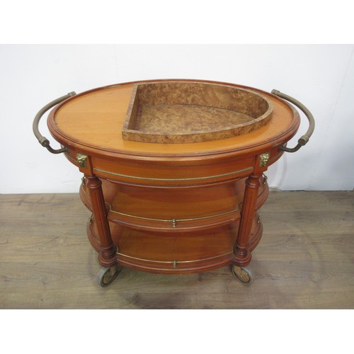 338 - A reproduction oval drinks Trolley with cooler to the upper tier and having brass fittings, 3ft 9in ... 