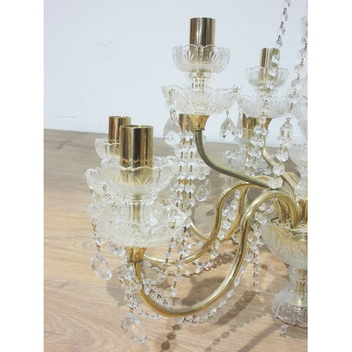 523 - A cut glass and brass Chandelier with two rows of eight and four branches with droplets 2ft D x 1ft ... 