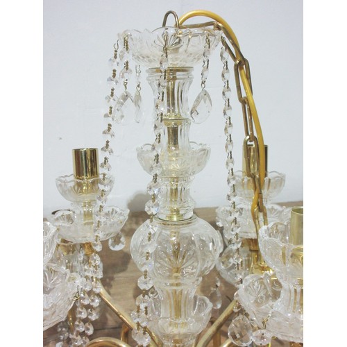 523 - A cut glass and brass Chandelier with two rows of eight and four branches with droplets 2ft D x 1ft ... 