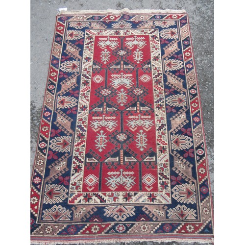 444 - An Oriental blue ground Rug with red border 6ft L x 3ft 11in W