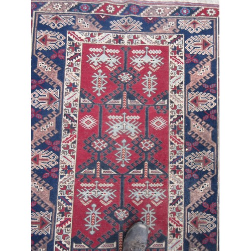 444 - An Oriental blue ground Rug with red border 6ft L x 3ft 11in W