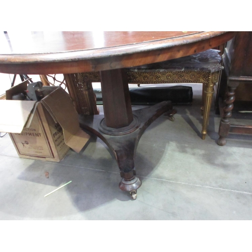 518 - A 19th Century mahogany Breakfast Table on octagonal column and three brass casters 3ft 10in D x 2ft... 