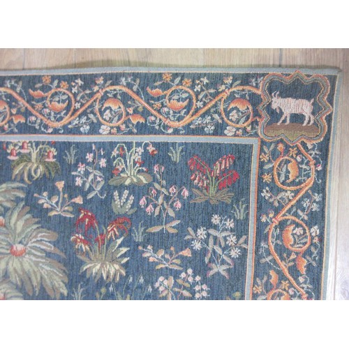 628 - A needlepoint Tapestry in the Medieval style depicting a Unicorn 4ft 6in H x 3ft 6in W and oak frame... 