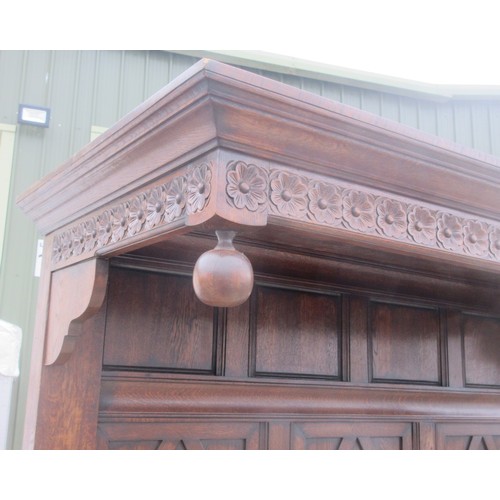 642 - A well made panelled oak Half Tester Bed in the 17th Century style with fitted mattress, the canopy ... 