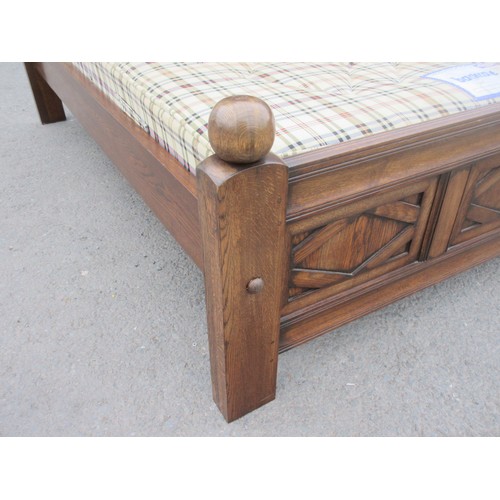 642 - A well made panelled oak Half Tester Bed in the 17th Century style with fitted mattress, the canopy ... 