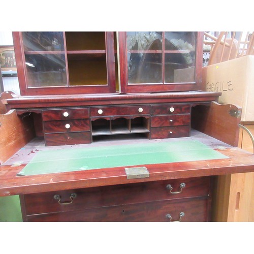 549 - A 19th Century mahogany Secretaire Bookcase, the upper section fitted pairof gothic arched glazed do... 