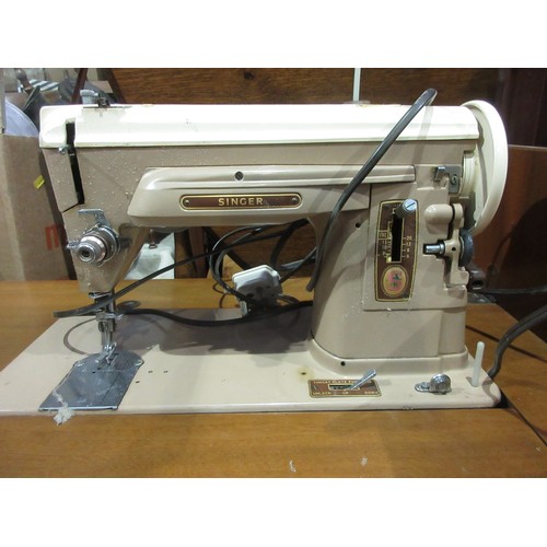 554 - A Sewing Machine in reproduction serpentine fronted Table with two dummy drawers 2ft 8in H x 2ft 3in... 