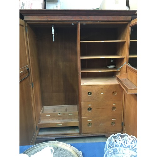 189 - An oak double panelled two door Wardrobe 6ft H x 4ft 8in W