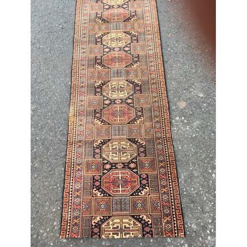 19 - A very long Hall Runner with geometric design within multiple borders 19ft 4in L x 2ft 3in W