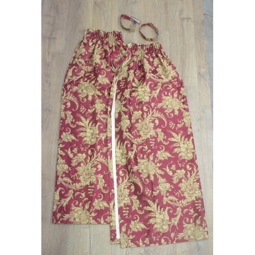 115 - A pair of deep red Curtains with gold floral decoration 4ft L x 4ft W approx