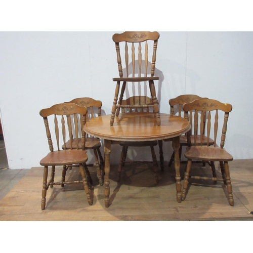 125 - A modern pine circular Dining Table 3ft 9in W with spare leaf and six Chairs