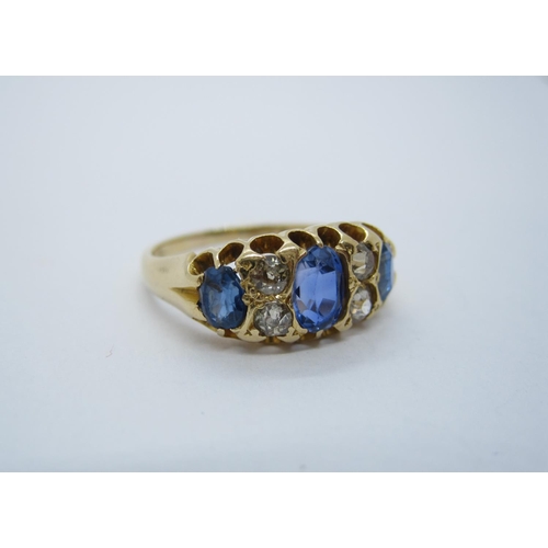 184 - A late 19th Century Sapphire and Diamond Ring pave-set three graduated oval-cut sapphires with pairs... 