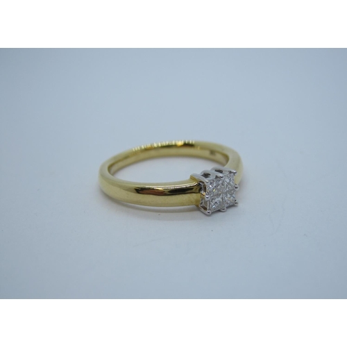 190 - A contemporary Diamond Ring peg-set cluster of four princess-cut stones in 18ct gold, ring size L.