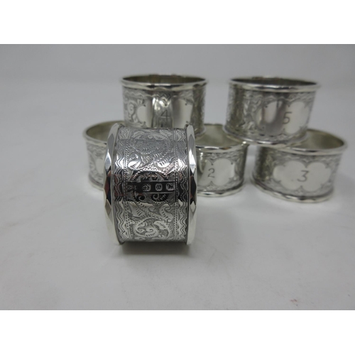 229 - Six Victorian silver circular Napkin Rings leafage scroll engraved and numbered 1-6, Birmingham 1897... 