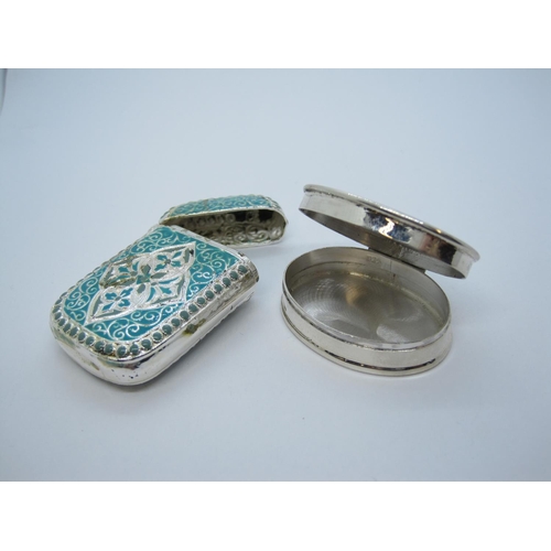 230 - An oval white metal Pill Box stamped 925, having hinged enamelled lid with vintage motor racing scen... 