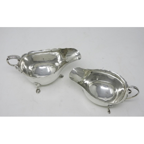 233 - An Edward VII silver Sauce Boat with shaped rim, leafage scroll handle on hoof feet, London 1908, an... 