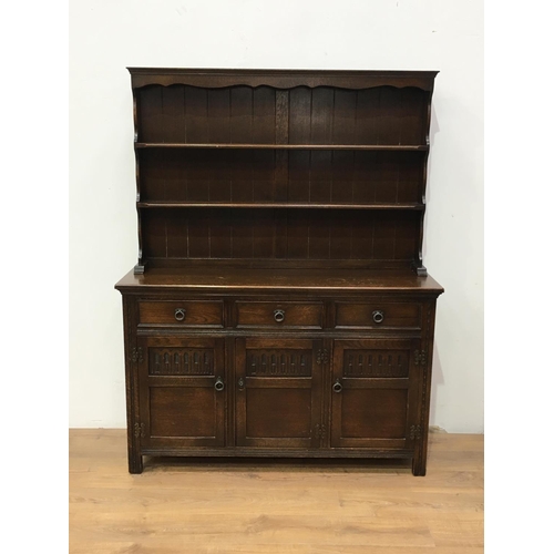 342 - A reproduction oak Dresser and Rack fitted three frieze drawers and three nulled panelled doors 5ft ... 